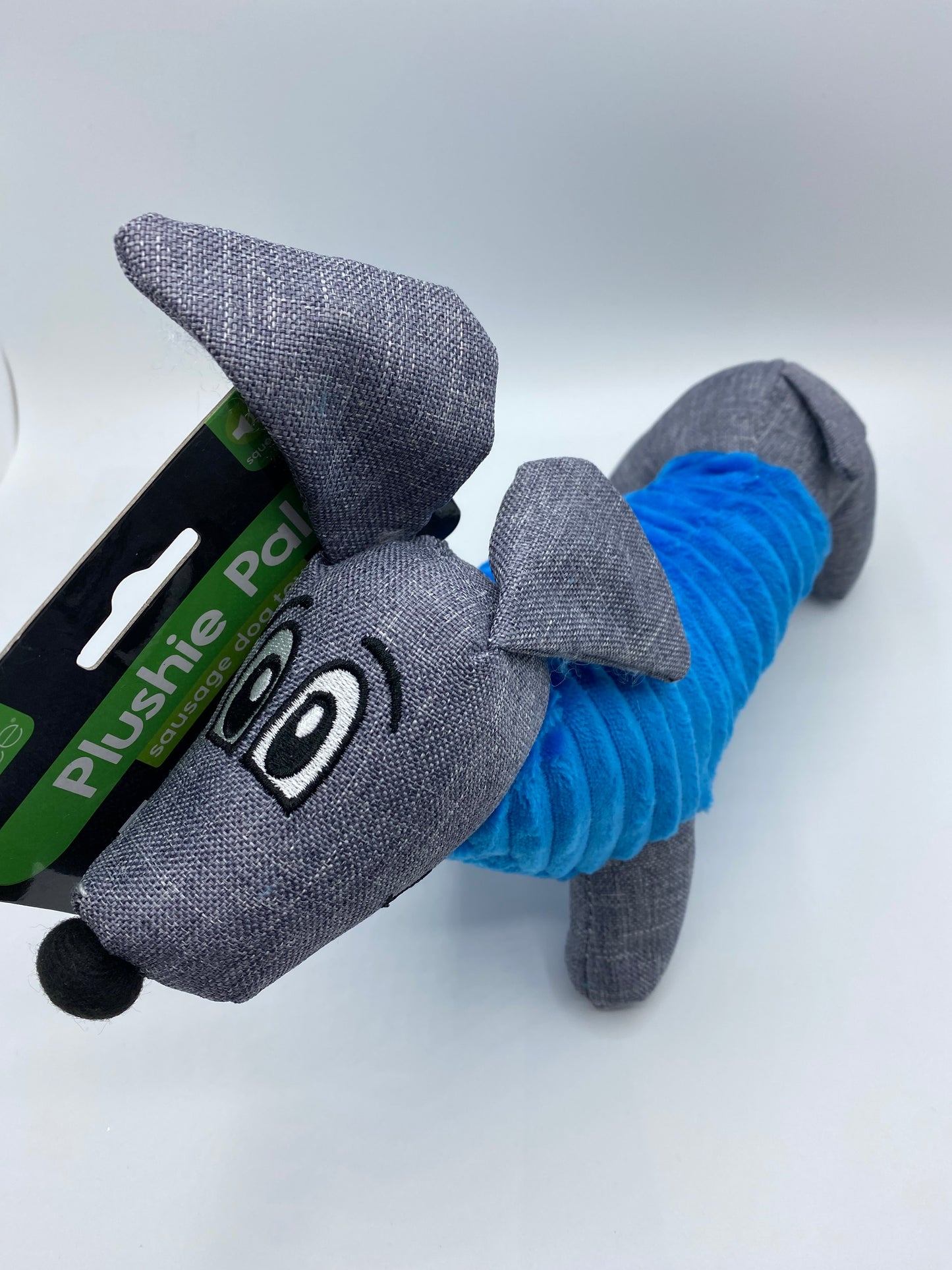 Plush Sausage Dog Toy With Squeaker size approx 30cm Long Red, Yellow, Orange and Blue